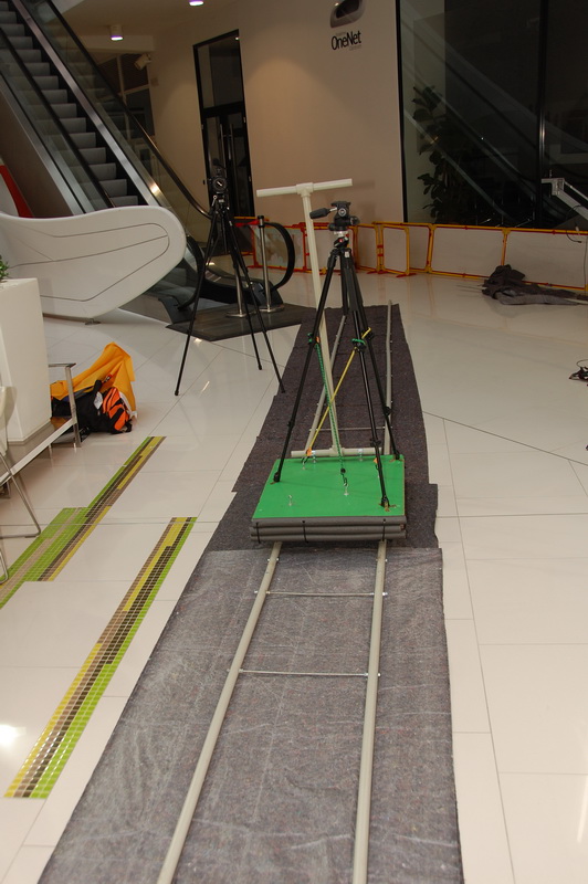 Camera dolly on rails with carpet below to smooth out the movement.